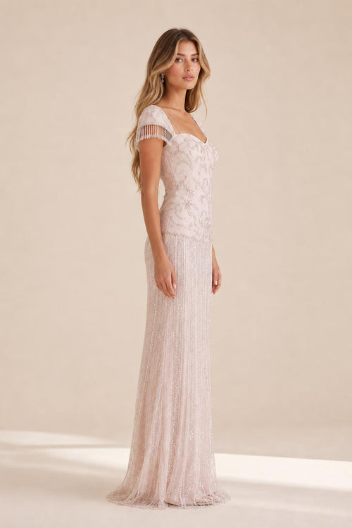 Side profile view of the blush evening gown